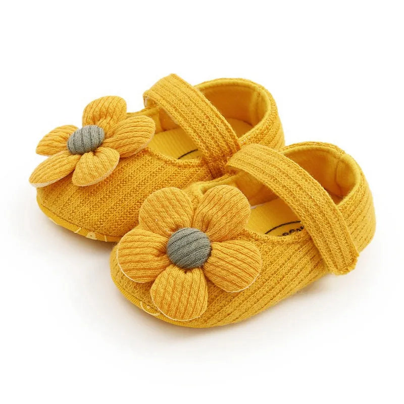 Pink soft sole baby sneakers, anti-slip with a floral bow, perfect for toddler girls.