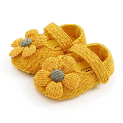 Pink soft sole baby sneakers, anti-slip with a floral bow, perfect for toddler girls.