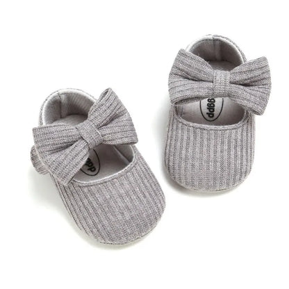 Baby shoes: Blue anti-slip soft sole sneakers with a simple, chic bow for girls.