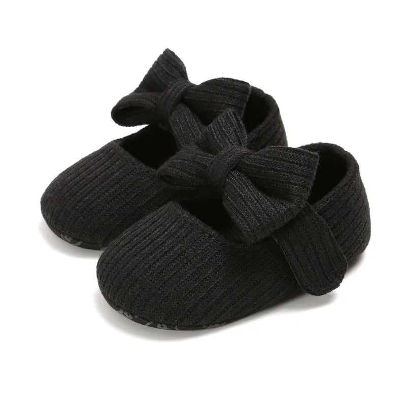 Aqua anti-slip infant girl sneakers with a vibrant bow, designed with a soft comfort sole.