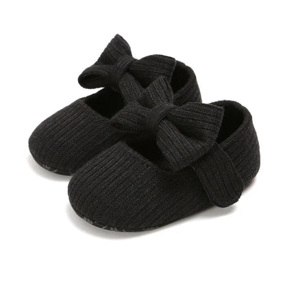Aqua anti-slip infant girl sneakers with a vibrant bow, designed with a soft comfort sole.