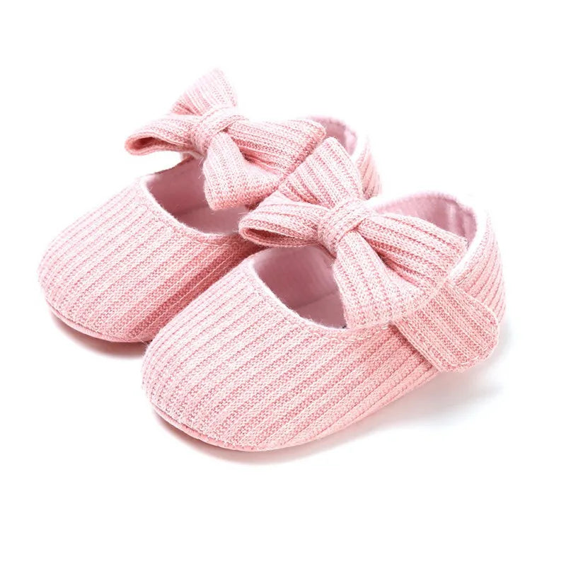 Dark pink baby girl's anti-slip sneakers, soft sole with a lovely bow for infants.