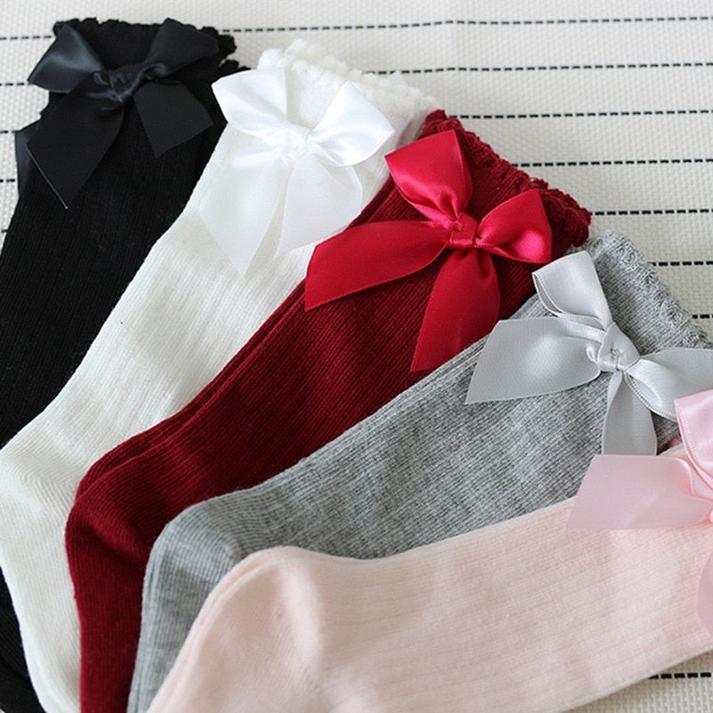 Baby girls' pink bowknot cotton knee-high socks, soft infant apparel