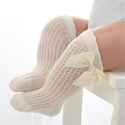 Comfortable and cute baby girls' knee-high cotton socks, bow detail