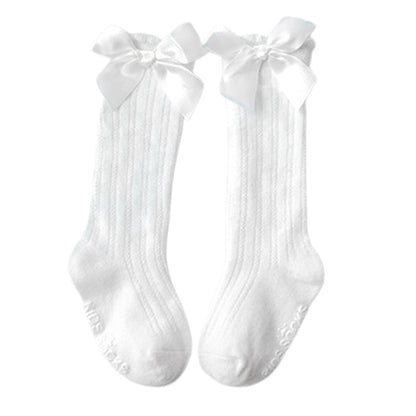 Cute baby girls' white cotton knee-high socks with delicate bowknot detail