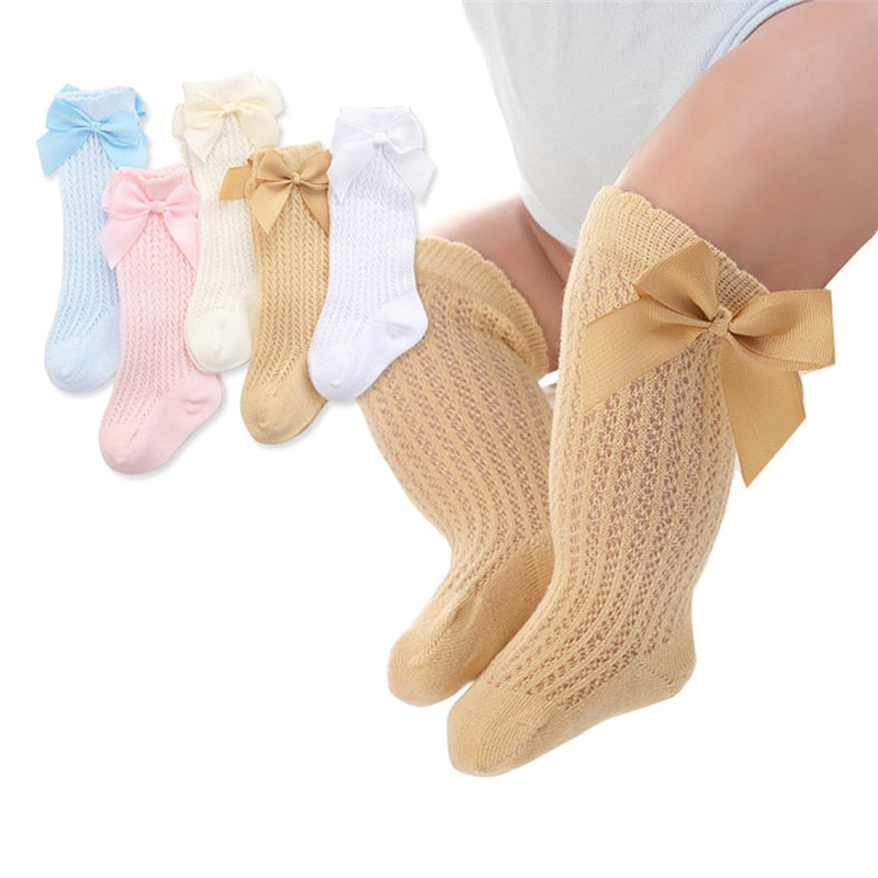 Cute bowknot detail on baby girls' white cotton knee-high socks