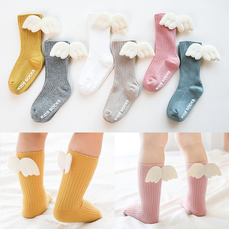 Baby girls' durable cotton knee-high socks, perfect for toddlers, with bow