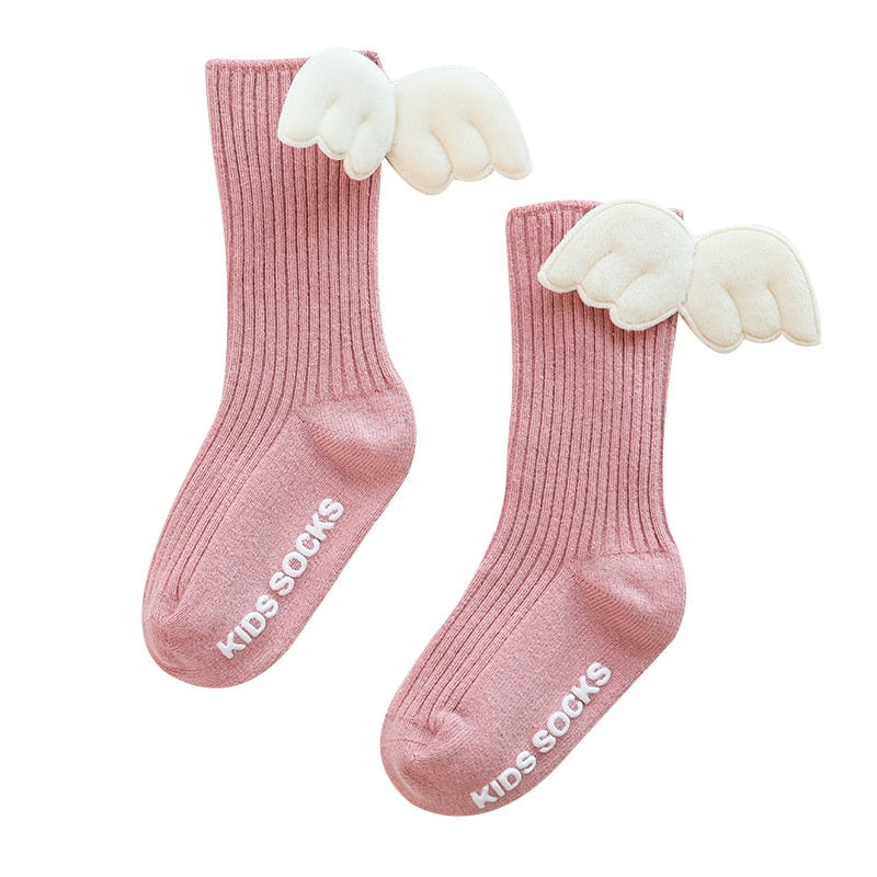 Breathable cotton knee-high socks for baby girls, featuring a small bow