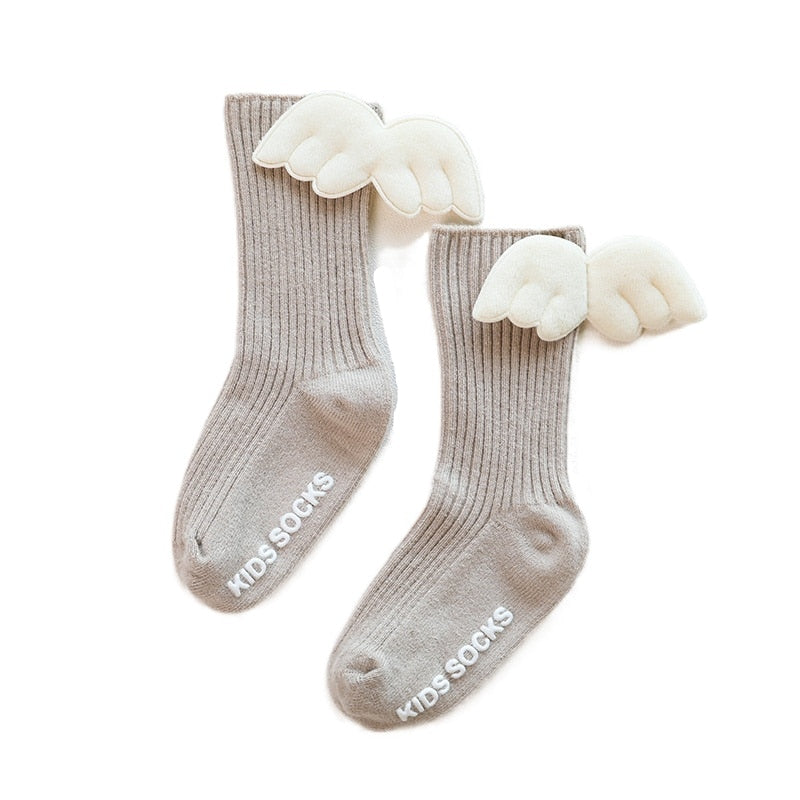 Toddler girls' stylish knee-high socks, light pink with a decorative bow