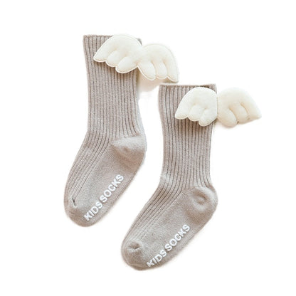 Toddler girls' stylish knee-high socks, light pink with a decorative bow