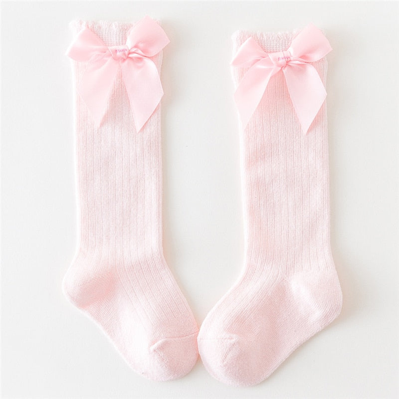 Set of baby girls' cotton knee-high socks, various colors with bow details