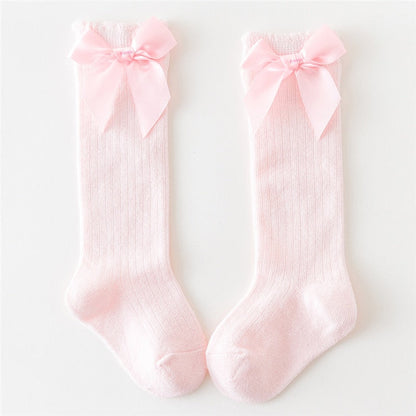 Set of baby girls' cotton knee-high socks, various colors with bow details