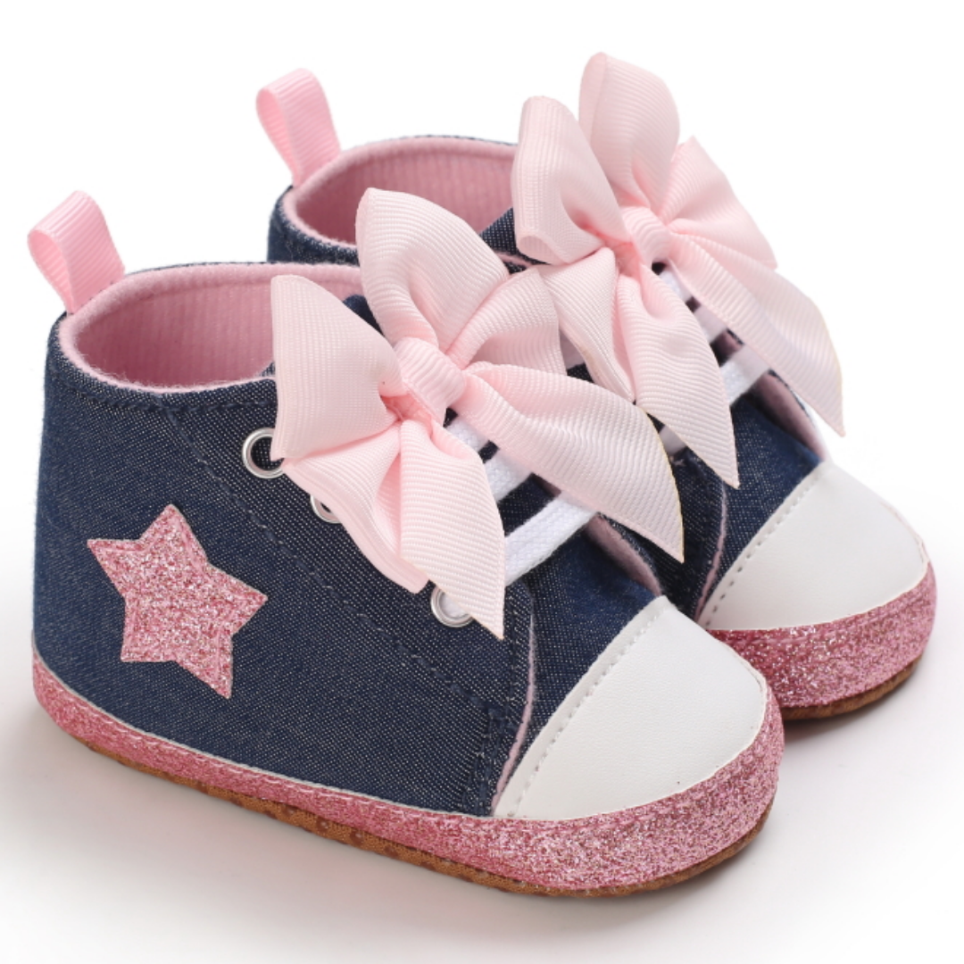 Side view of pink hi-top canvas baby shoes for first walkers, with secure lacing