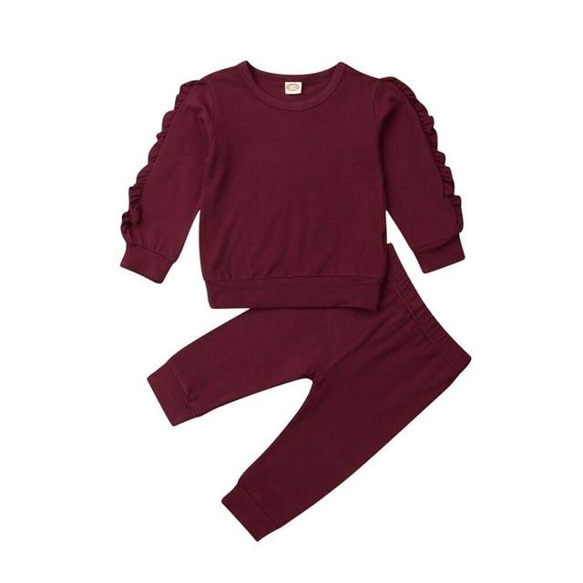 Two-piece baby girls' cotton outfit: solid pink sweatshirt and patterned trousers, comfy wear