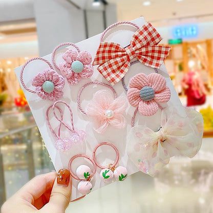 Elastic hair ties and matching headbands for baby girls, featuring bows and cute embellishments
