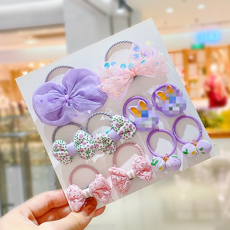Soft pink and white baby girl's elastic hair ties & matching headbands, perfect for infants