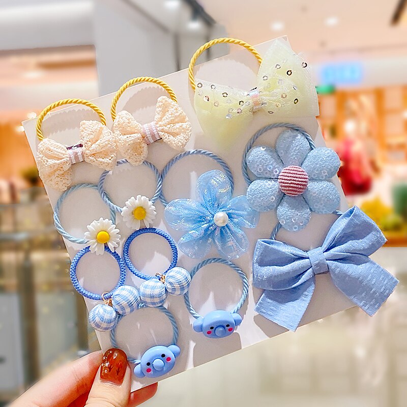 Baby girl's hair accessories: elastic ties with bows and stretchy headbands in a cute set