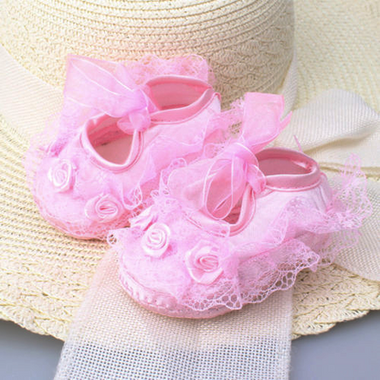 Delicate white floral lace baby girl shoes with satin ribbon, perfect prewalker soft soles.