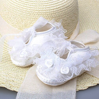 Infant baby girl shoes: blush pink satin and floral lace, designed for comfort and style.