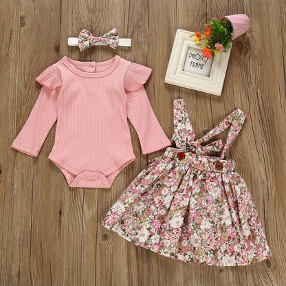 Baby girls' pink floral ruffled romper & skirt set, perfect for summer. Cotton blend baby outfit.