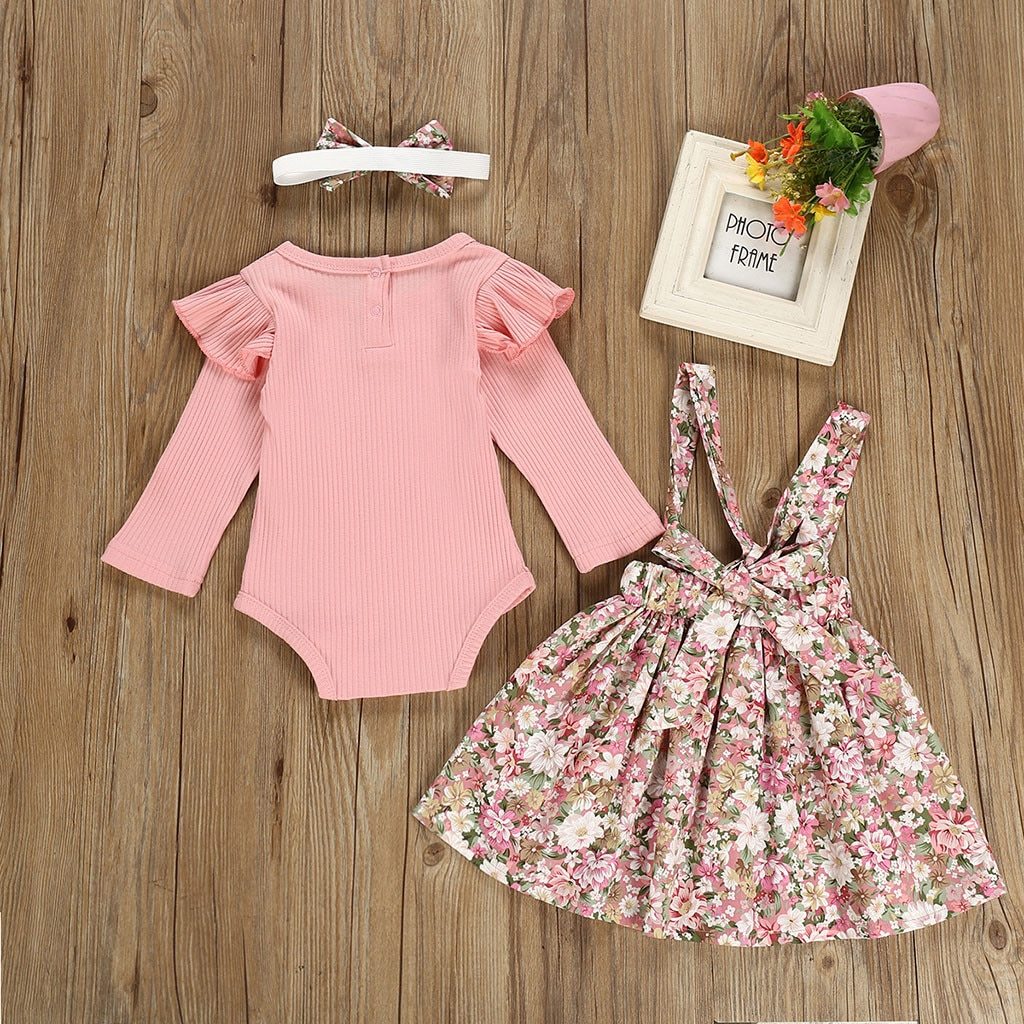 Cute mauve baby girls' floral romper with ruffled sleeves & matching skirt. Ideal for photo shoots.