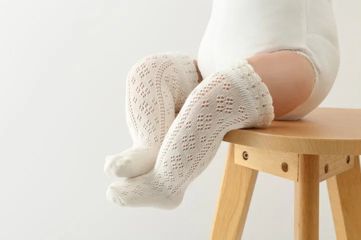 White baby girls' knee-high socks, hollow knit, enhancing breathability for active toddlers