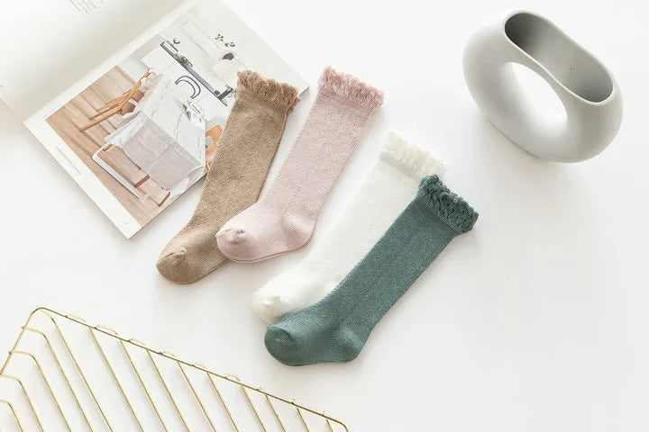 Colorful array of hollow knit knee-high socks, baby girls' breathable and comfy footwear