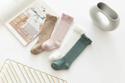 Colorful array of hollow knit knee-high socks, baby girls' breathable and comfy footwear