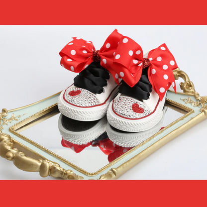 Adorable lace-up dotted canvas shoes with a bowknot, ideal for baby girl's everyday wear.