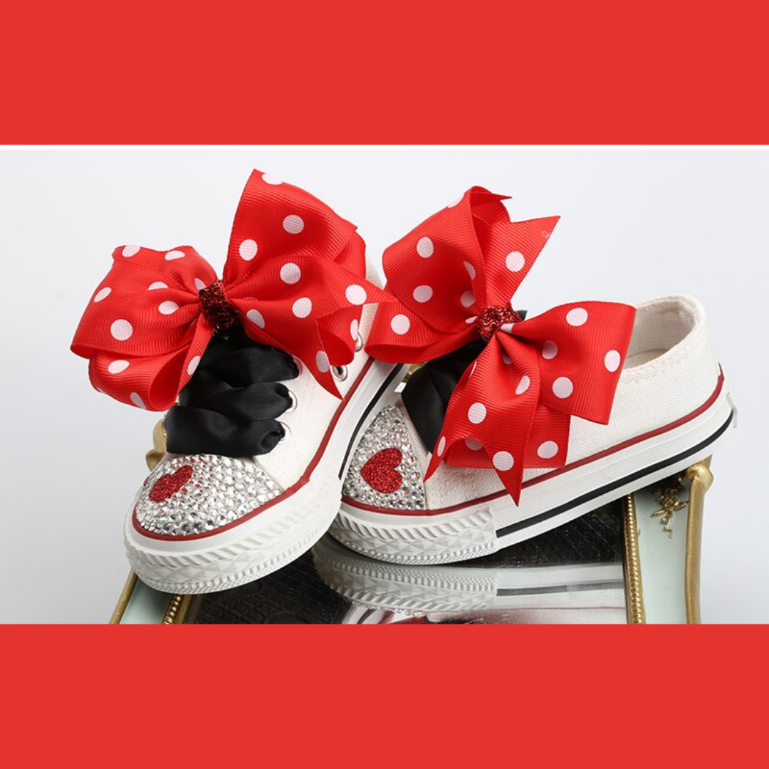 Soft pink cotton canvas baby shoes with polka dots and a decorative bowknot for infants.