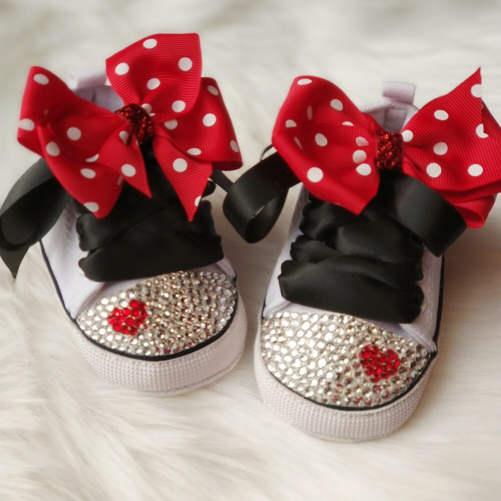 Comfortable baby girl polka dot canvas shoes featuring a sweet bowknot and lace-up design.