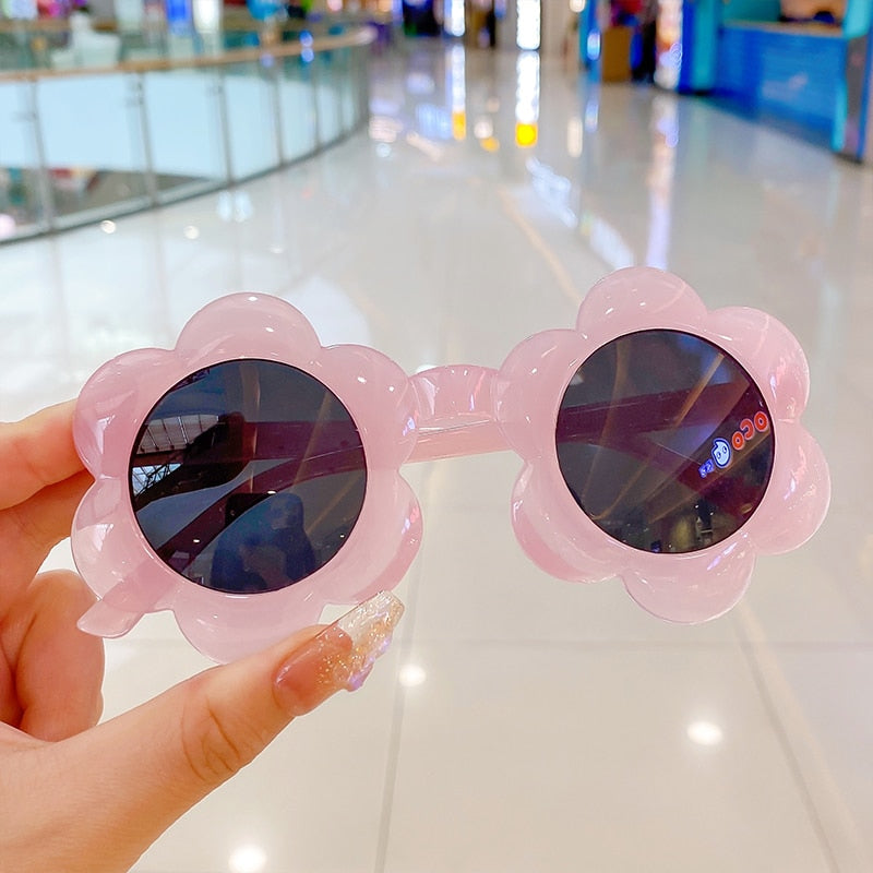 Playful pink round UV protection sunglasses for infants and toddlers, summer gear
