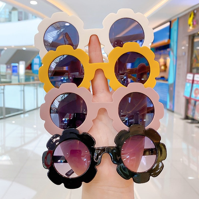 Trendsetting pink round toddler sunglasses with UV protection for outdoor fun