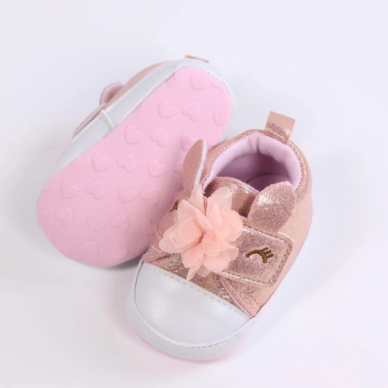 Adorable pink unicorn first walker shoes for baby girls, featuring magic details.