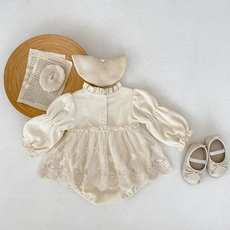 Comfortable cotton baby girls' bodysuit, pink, with waffle texture, puff sleeves, and lace trim.