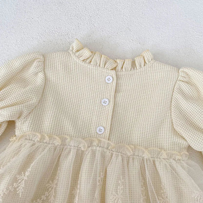 Cute pink waffle knit baby bodysuit for girls, designed with puff sleeves and elegant lace trim.