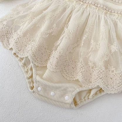 Soft pink baby girls' bodysuit, waffle fabric with puff sleeves and charming lace collar trim.