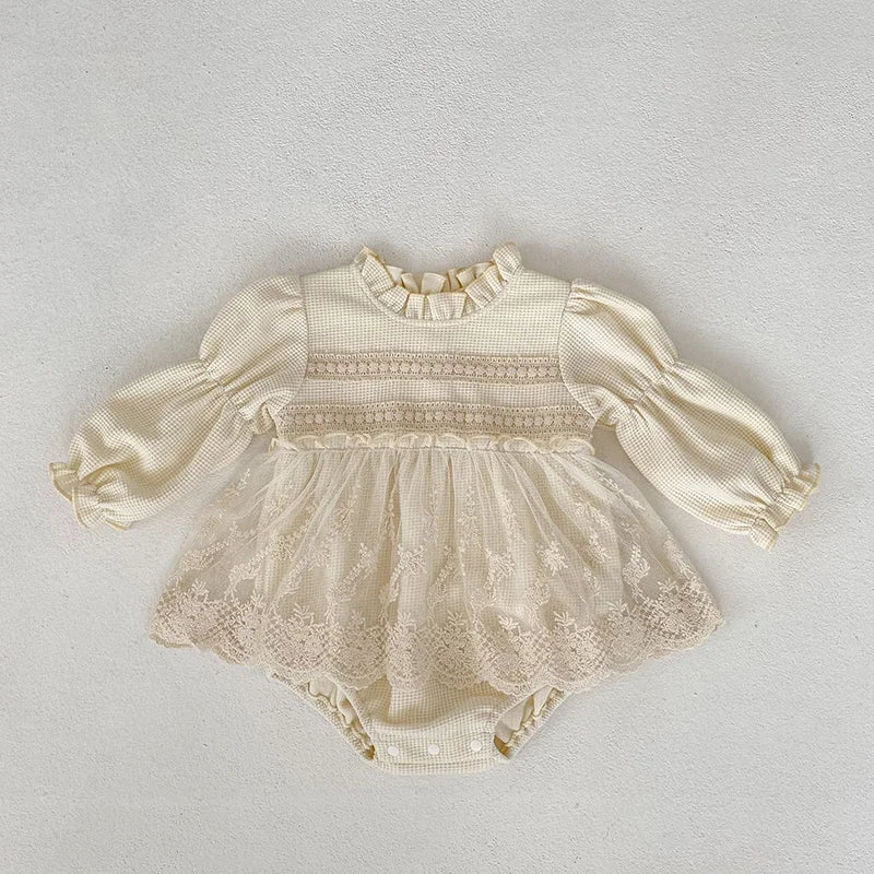 Front view of baby girls' pink waffle knit bodysuit, perfect for autumn wear, with puff sleeves.