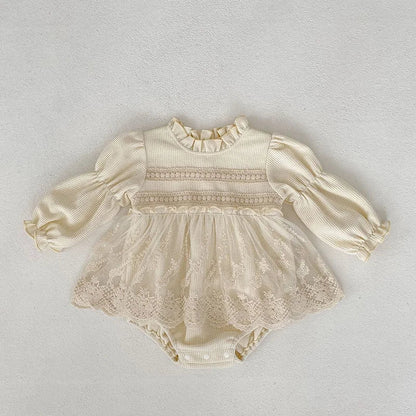 Front view of baby girls' pink waffle knit bodysuit, perfect for autumn wear, with puff sleeves.