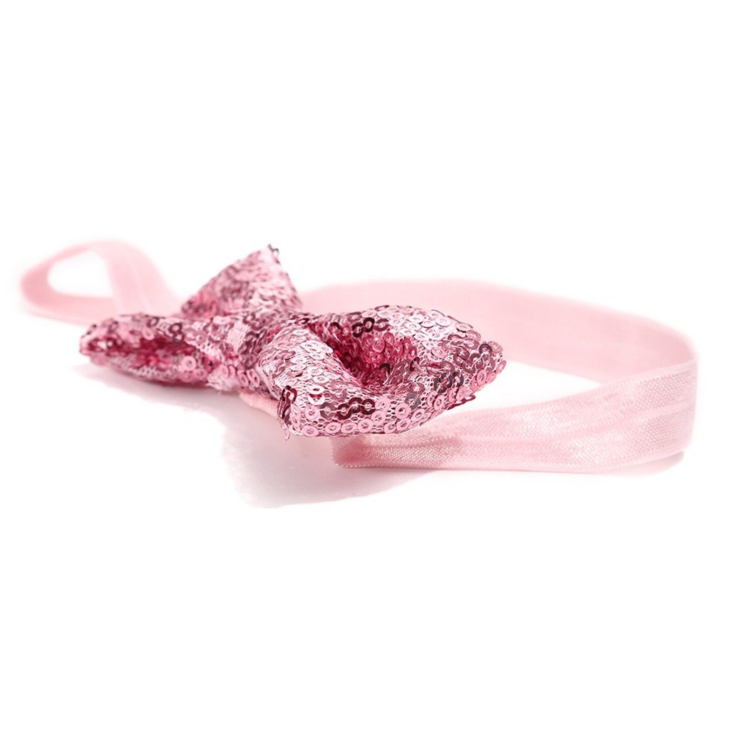 Soft baby headband with a shimmering pink sequin bow, a delightful accessory for little girls