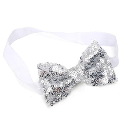 Detail of the glittery sequin bow on a baby girl's headband, perfect party accessory