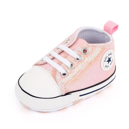 Vibrant pink sequined canvas first walking shoes for baby girls, an adorable infant footwear choice