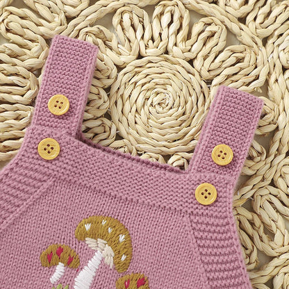 Close-up of knit texture on a baby girls' sleeveless bodysuit, acrylic comfort.