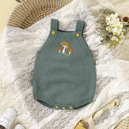 Newborn girl wearing a gentle white sleeveless knit bodysuit, perfect for sensitive skin.