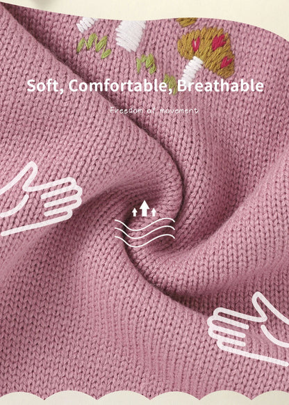 Detail of button closure on a baby girls' sleeveless knit romper, easy dressing.