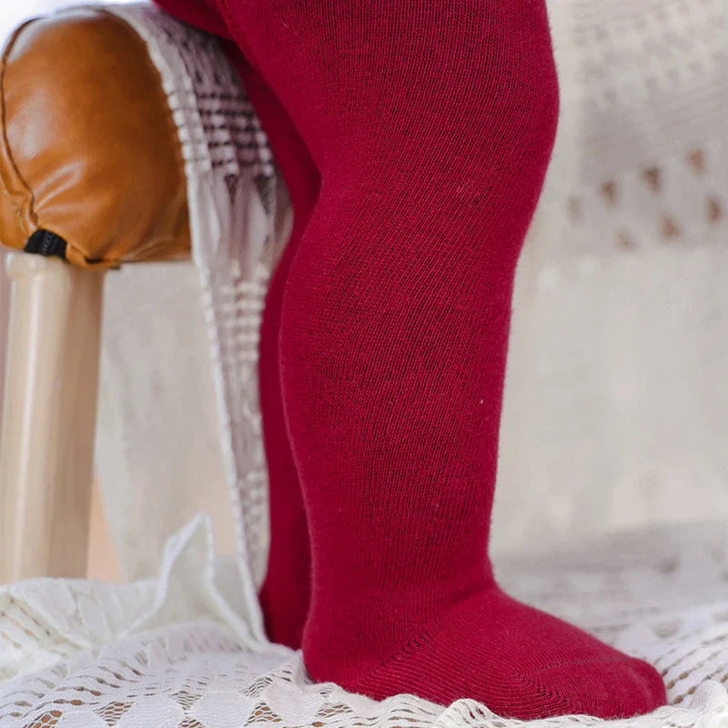 Baby girl essentials: cotton blend purple tights for everyday wear