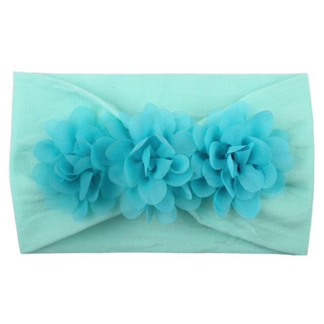 Pack of assorted baby girls' soft elastic flower headbands in different colors and floral styles.