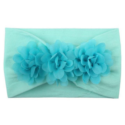 Pack of assorted baby girls' soft elastic flower headbands in different colors and floral styles.