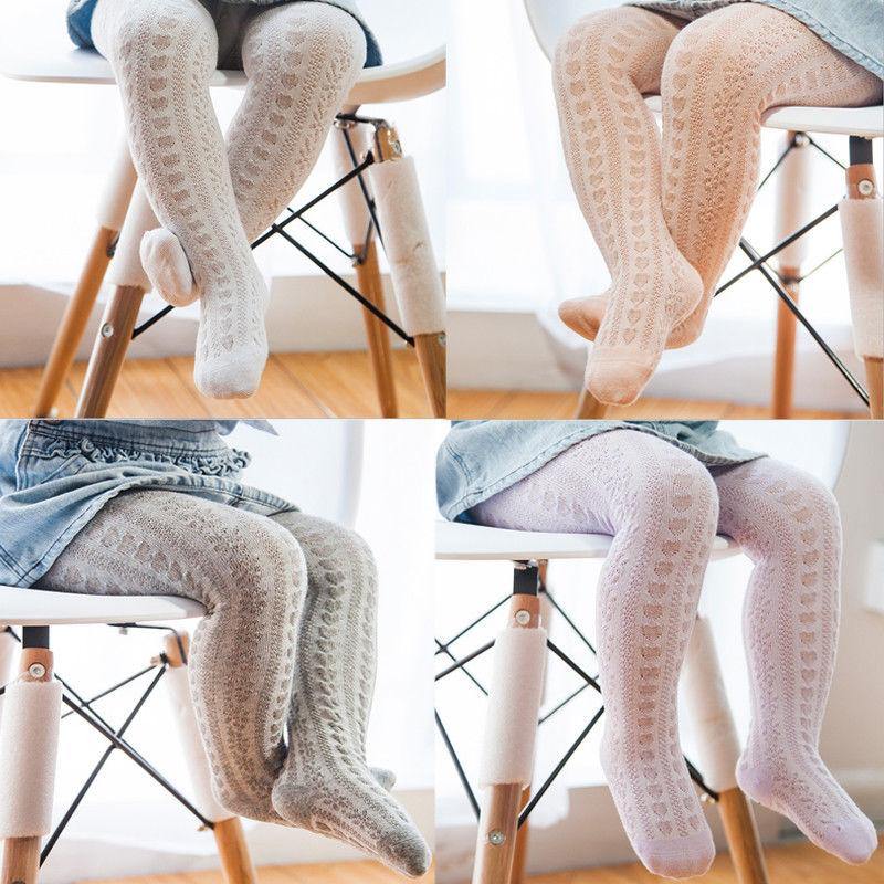 Model shot of a baby girl wearing comfortable cotton leggings for active toddlers