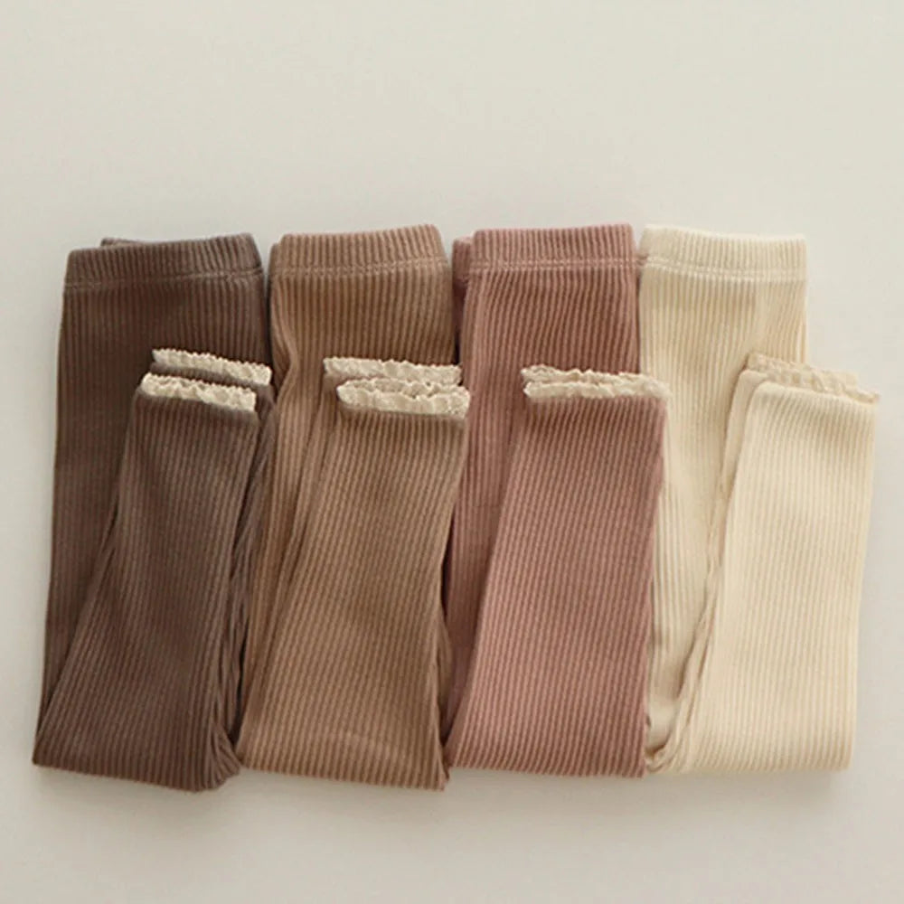 Baby girls' soft ribbed cotton leggings in pink, perfect for everyday wear and comfort.